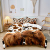 Highland cow print bedding set featuring a duvet cover and pillowcases displayed on a bed.
