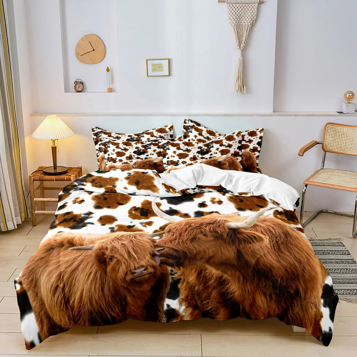 Highland cow print bedding set featuring a duvet cover and pillowcases displayed on a bed.