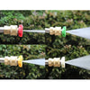 A set of quick-connect pressure washer nozzles showing different spray angles in red, green, and yellow.
