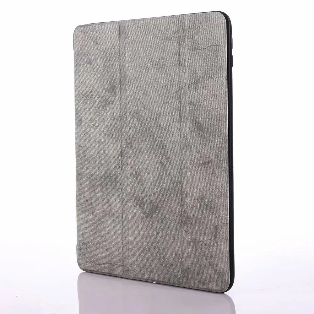 A gray Retro Marble iPad Pro 12.9 case with a built-in pencil holder.
