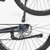 Close-up view of a black universal aluminum alloy bicycle kickstand attached to a bike wheel.