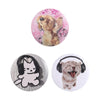A set of tinplate pins featuring cute designs of a dog and a cat.