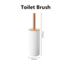 A white toilet brush with a wooden handle and bristles, shown vertically.