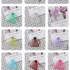 A collection of 10 color-coordinated organza drawstring jewelry gift bags in various shades of pink, yellow, green, and purpl