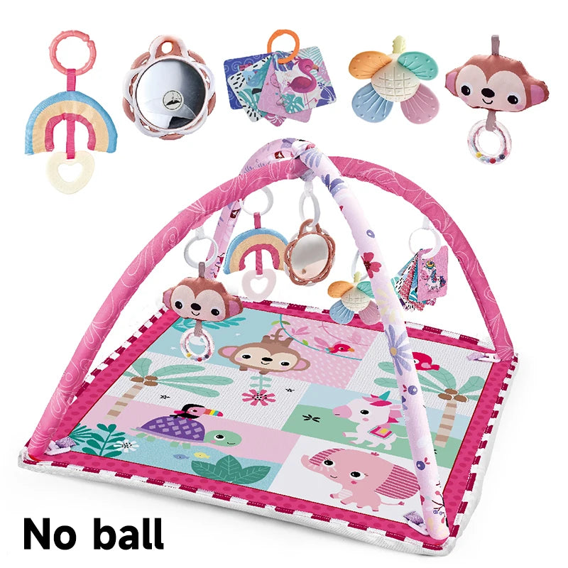 A pink baby play gym mat featuring various hanging toys including a mirror, animal shapes, and colorful fabric items.