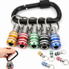 A black magnetic hex bit holder keychain with a quick-release chuck and various sized bits.