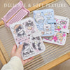 A hand holds a pink and light blue cartoon pu leather passport holder with cute animal designs on a wooden surface.