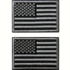A set of two embroidered American flag patches in tactical black and army green thread.
