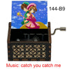 A wooden music box featuring a cardcaptor sakura theme with a hand crank and an 18-note mechanism.