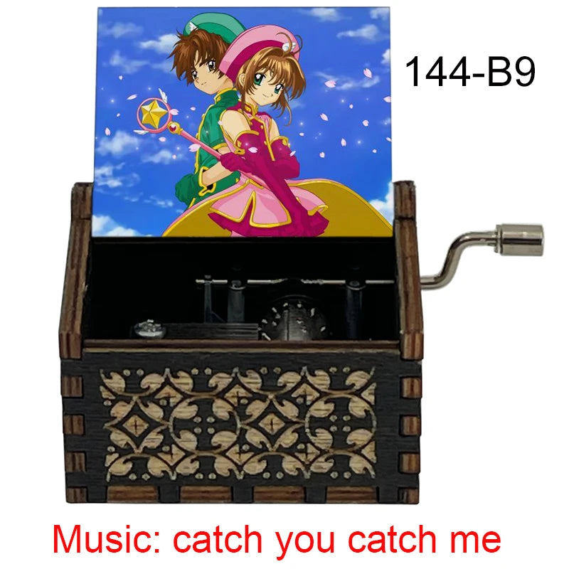 A wooden music box featuring a cardcaptor sakura theme with a hand crank and an 18-note mechanism.