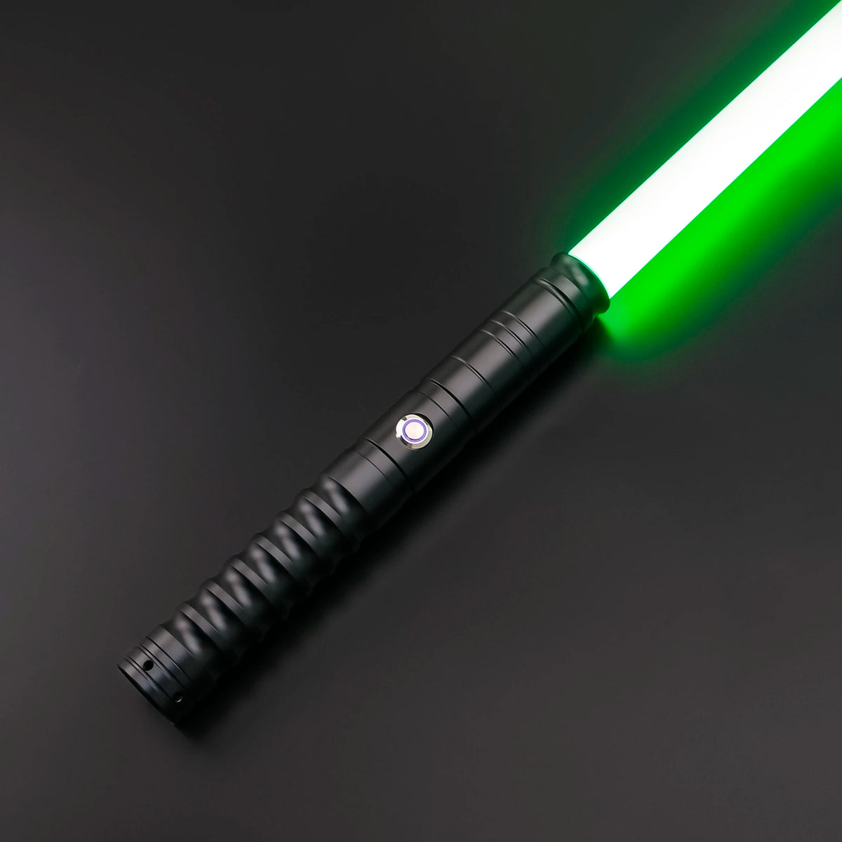 A black lightsaber with a bright green blade and metal hilt is shown against a dark background.