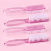 A set of pink nail art brushes with long handles and white bristles displayed on a light pink background.
