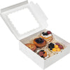 White bakery box with a clear window filled with assorted fruit and pastry treats