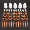 A collection of white and copper plasma cutter torch consumables, including nozzles and tips.