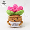 Handmade crochet positive energy doll shaped like a flower with a brown body and green leaves