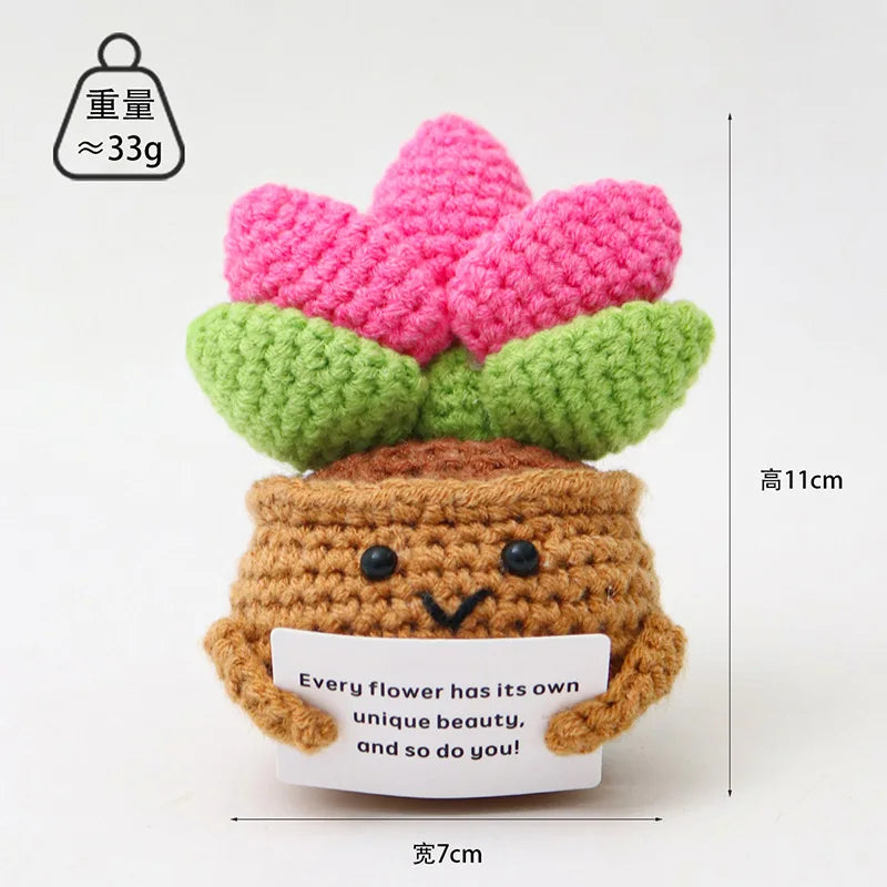 Handmade crochet positive energy doll shaped like a flower with a brown body and green leaves