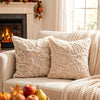 A collection of cream-colored plush throw pillow covers featuring autumn pumpkin and maple leaf designs.