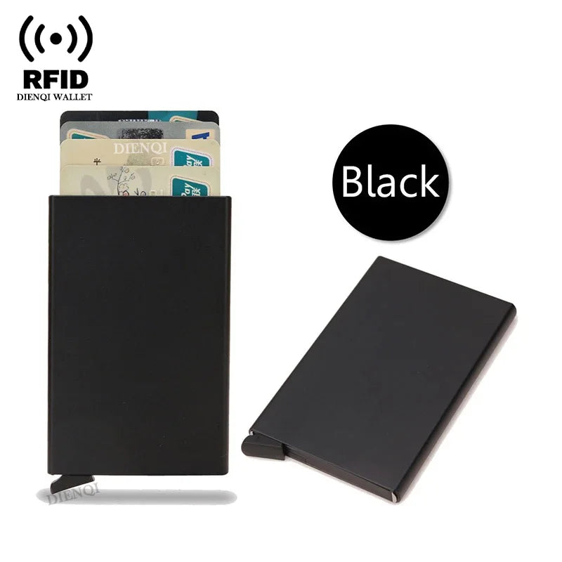 A black slim metal RFID blocking card holder with a pop-up design and a stack of cards.