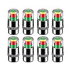 A set of four color-coded tire pressure indicator valve caps with red and green accents.