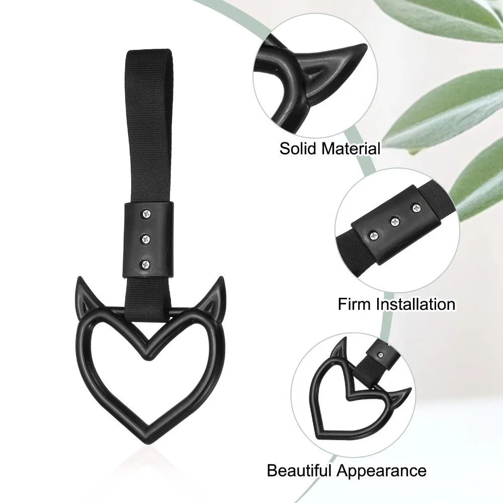 Black heart-shaped car handle decor featuring a solid material and firm installation for a beautiful appearance