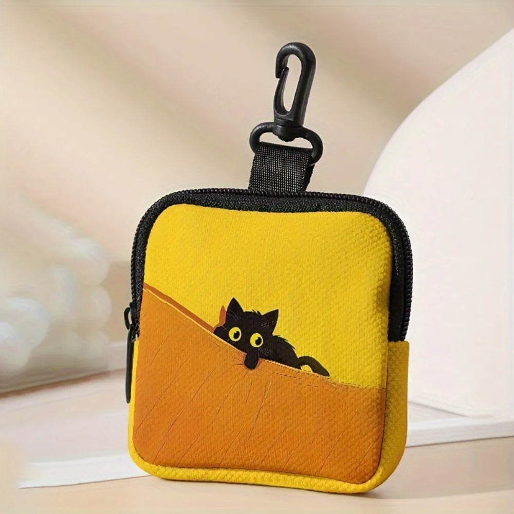 A yellow pouch with a black cat design is shown against a light background.