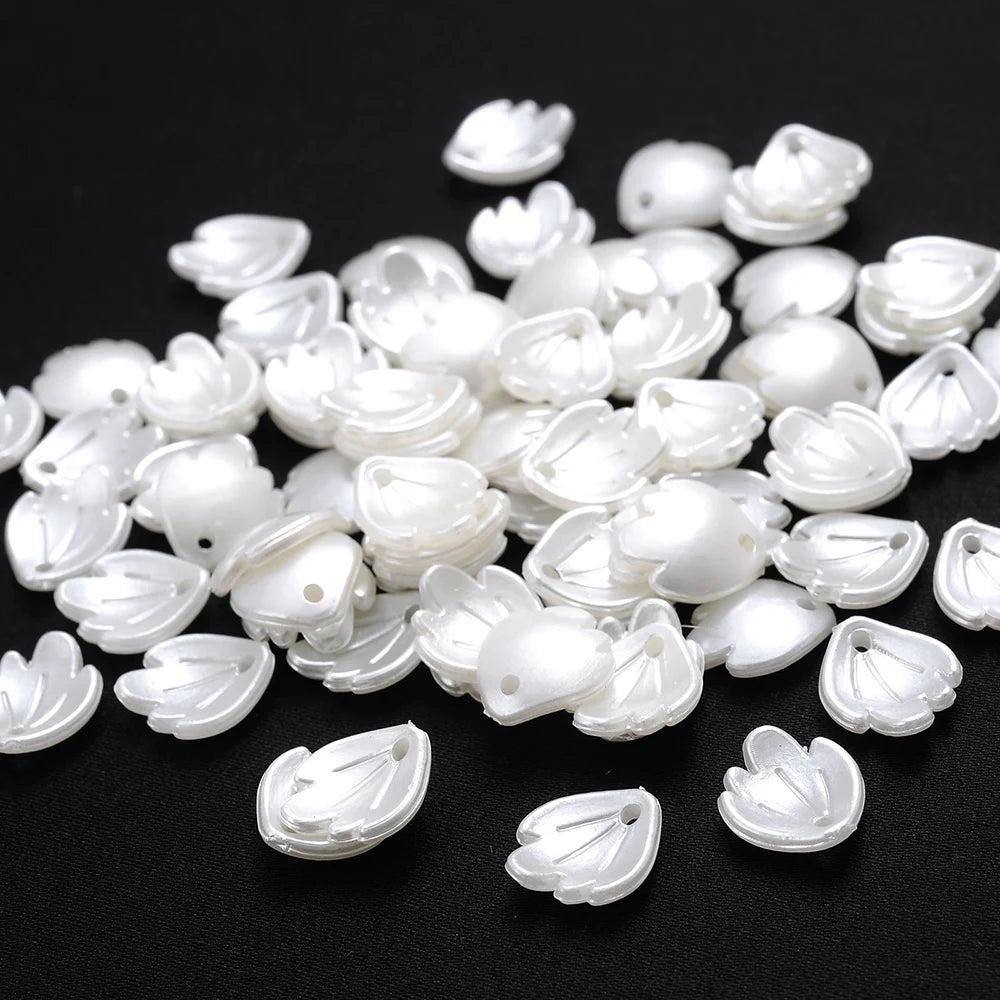 A pile of 100 white acrylic pearl spacer beads for jewelry making