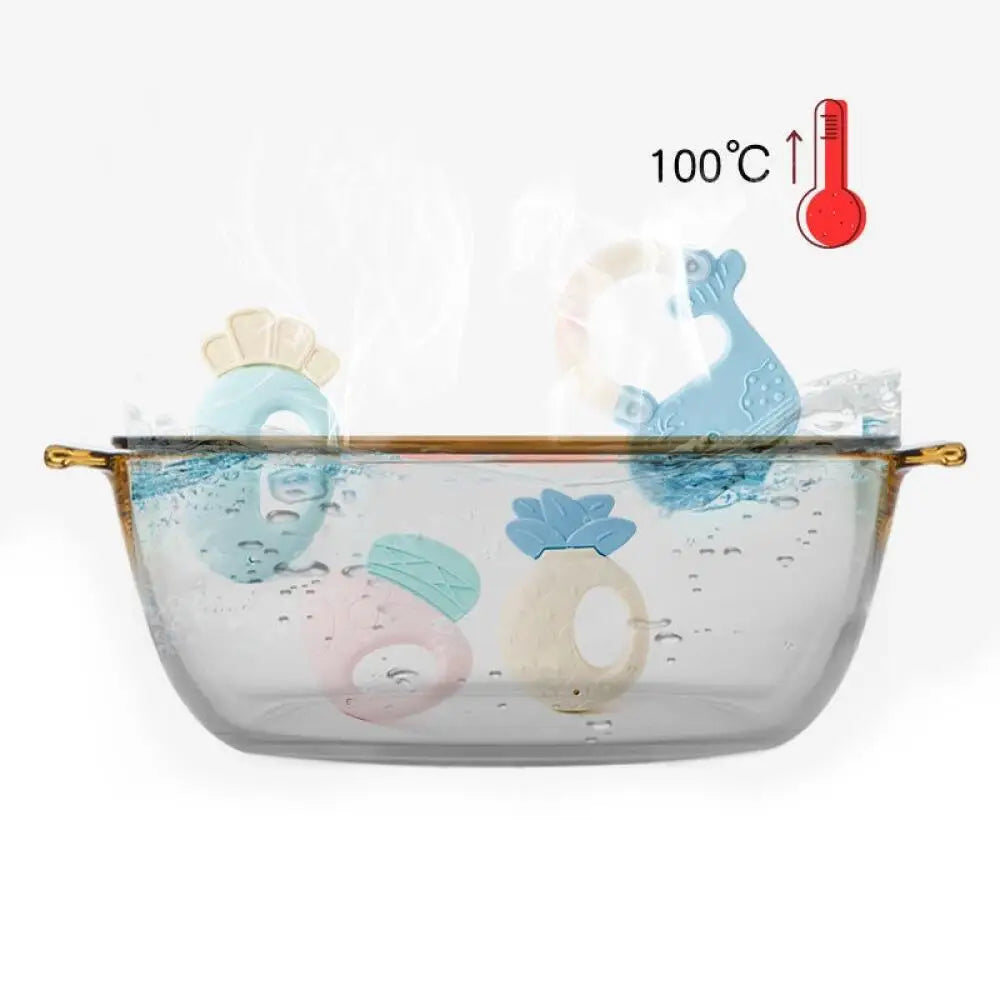 A clear silicone fruit teether and rattle set with various colored fruit shapes shown against a white background.
