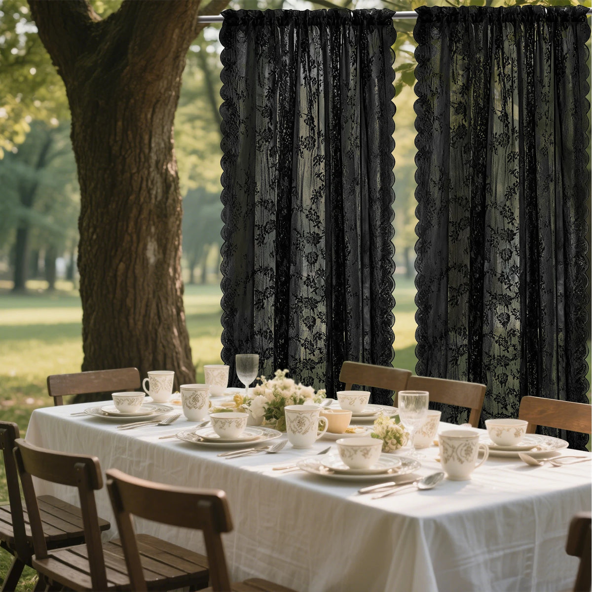 Two dark floral lace sheer curtains hanging in an outdoor or indoor setting.