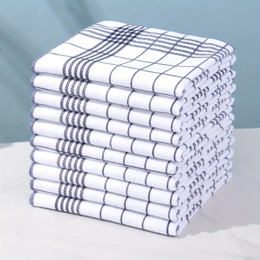 A stack of six white and gray absorbent lint-free dish cloths or kitchen towels are neatly folded on a white surface.