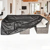 Black waterproof outdoor furniture cover draped over a patio sofa and table.