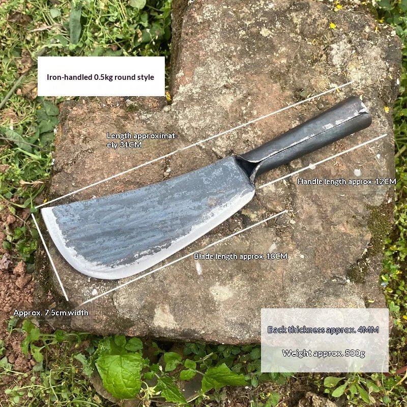 A forged steel axe with a round style blade and handle, shown resting on a rock.