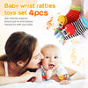 A woman is holding a baby while showing a set of four soft wrist rattles and foot finder socks for newborns.