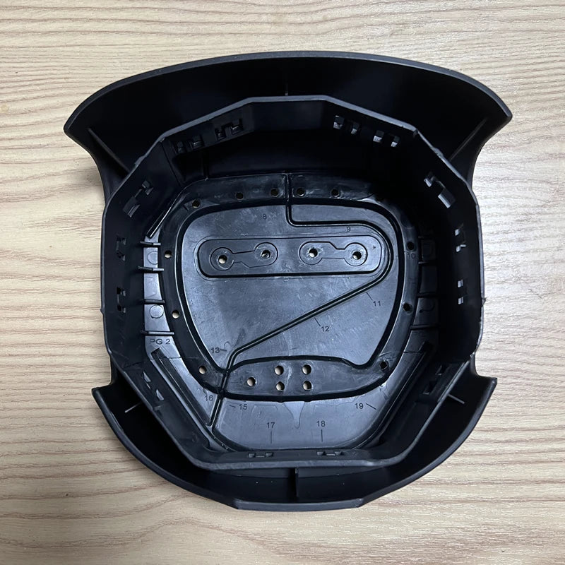 Black Dodge SRT steering wheel SRS cover with emblem shown from above