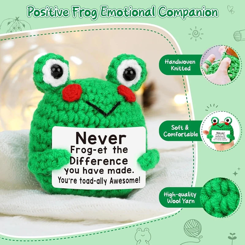 A handmade knitted frog emotional companion doll in green with a positive message card