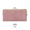 A pink leather wallet with a gold-toned clasp and a rectangular shape.