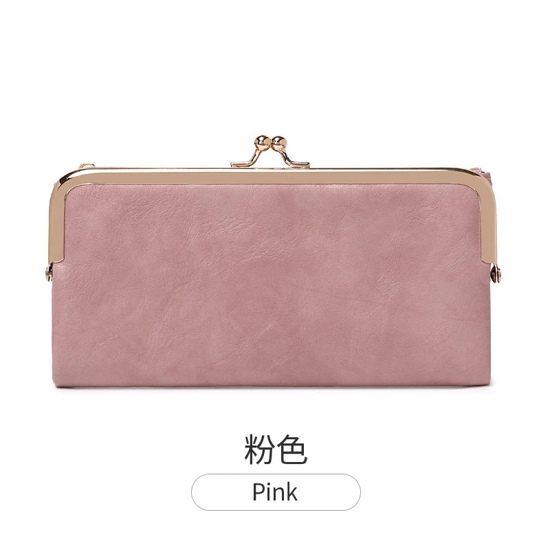 A pink leather wallet with a gold-toned clasp and a rectangular shape.