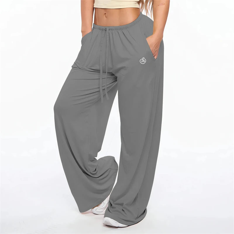 Gray women's flare leggings with a drawstring waist and a small logo detail