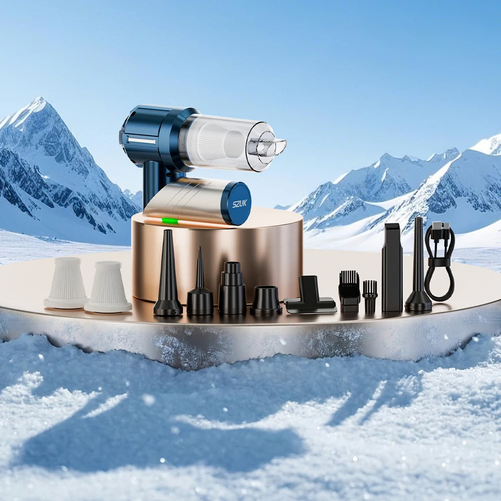 A foldable handheld car vacuum cleaner with various attachments displayed on a snowy landscape.