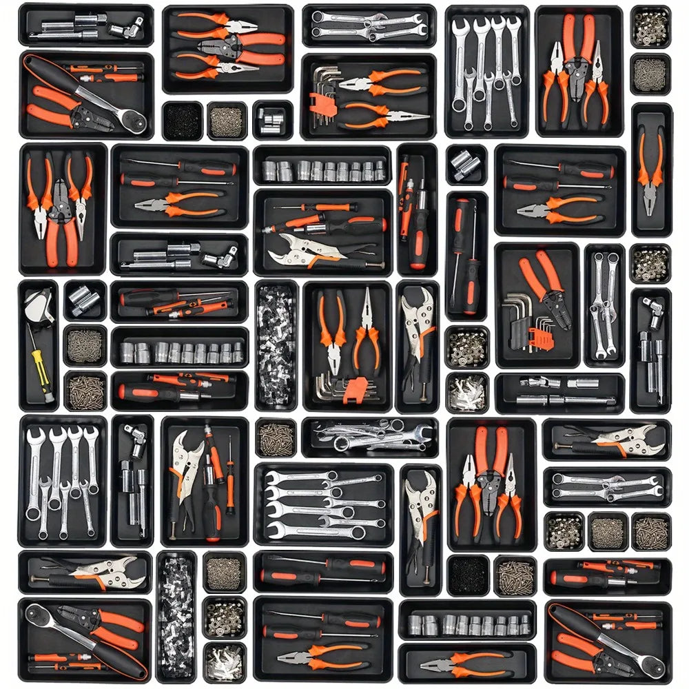 A collection of modular drawer organizer trays featuring various tools and implements in black, orange, and silver.