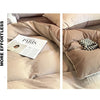 Close-up view of a beige ultra-soft washed cotton duvet cover set featuring soft fabric and decorative pearl accents.