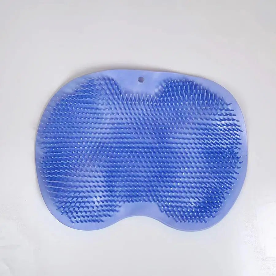 A light blue silicone scrubber pad with textured ridges used for showering or massage.