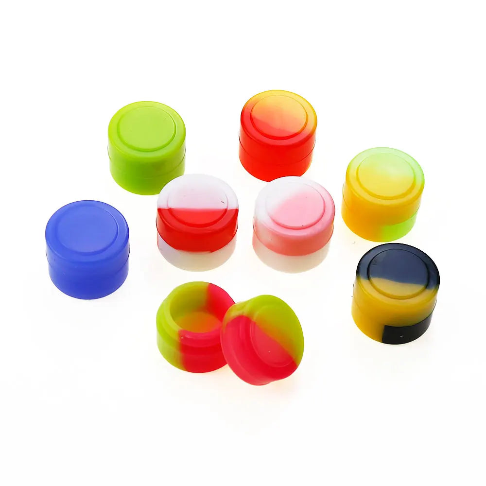 A collection of colorful silicone travel jars in shades of green, orange, red, yellow, and blue.