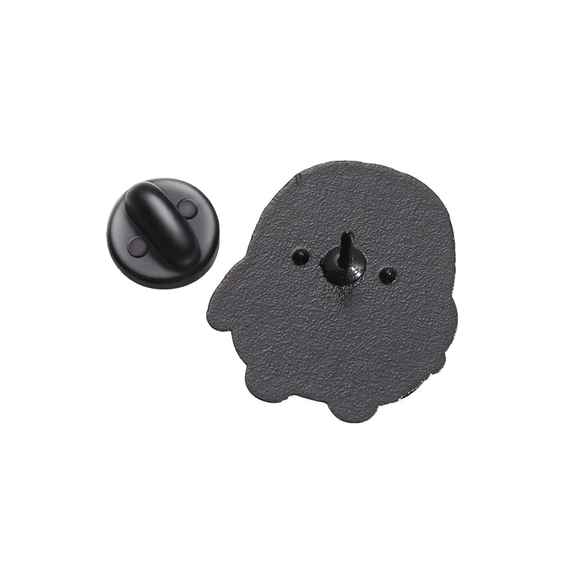 A black enamel pin shaped like a cartoon penguin with a small stud detail.