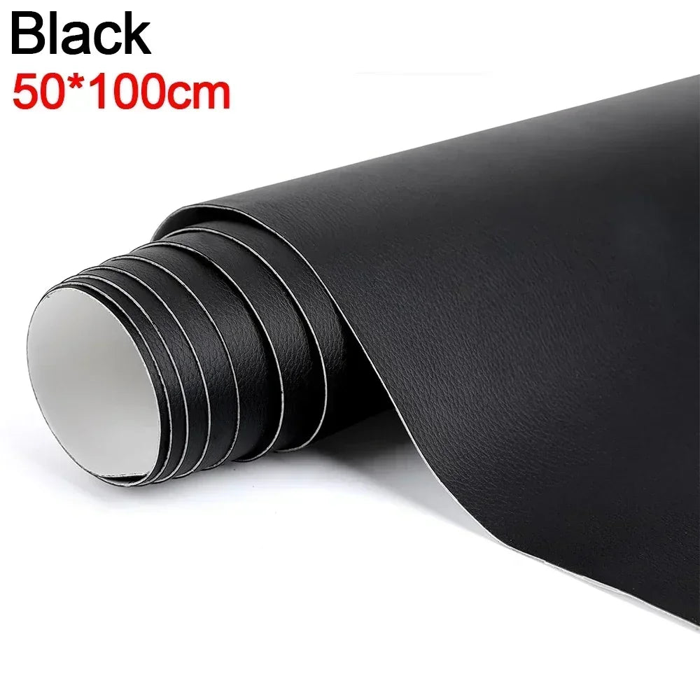 Roll of black self-adhesive leather repair tape measuring 50x100cm shown in a rolled format