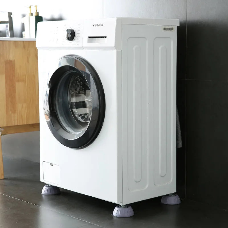 A white washing machine with a glass door is shown standing on a dark floor.