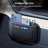 A black car seat side pocket organizer holding a smartphone and a card in a car interior.