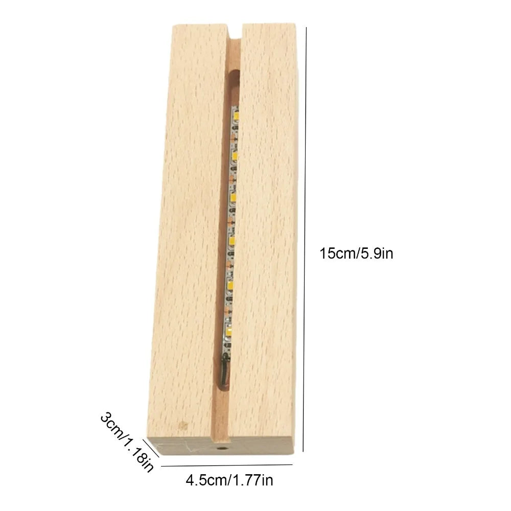 Illuminated acrylic guitar pick holder with a light wooden base and vertical illumination.