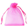 A sheer pink organza drawstring gift bag with pink ties.