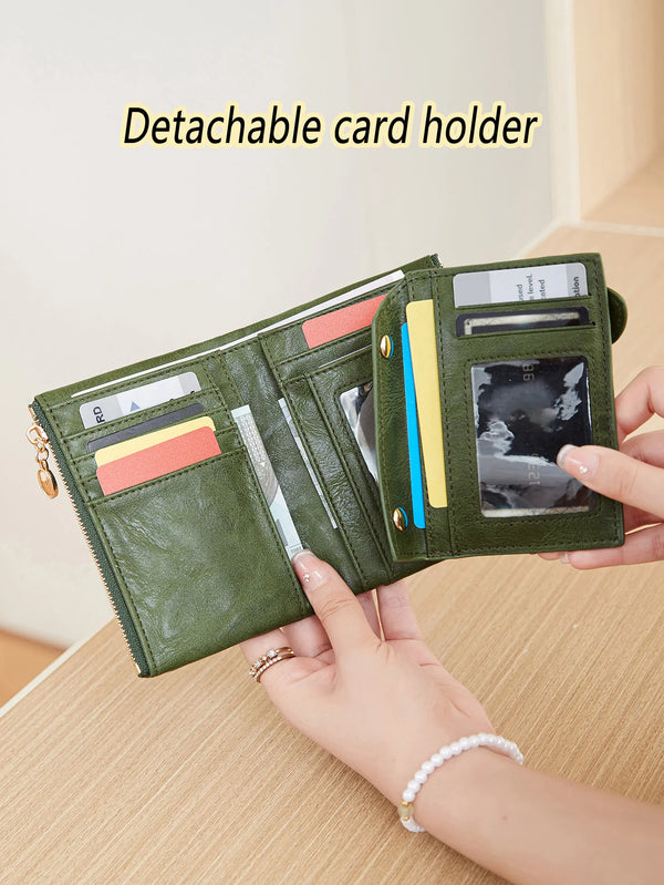 A hand holds a green detachable card holder wallet displaying various cards and ID documents.