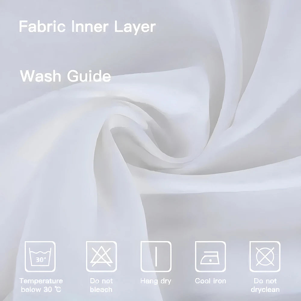 A white fabric inner layer with washing instructions displayed on a soft, flowing white fabric background.